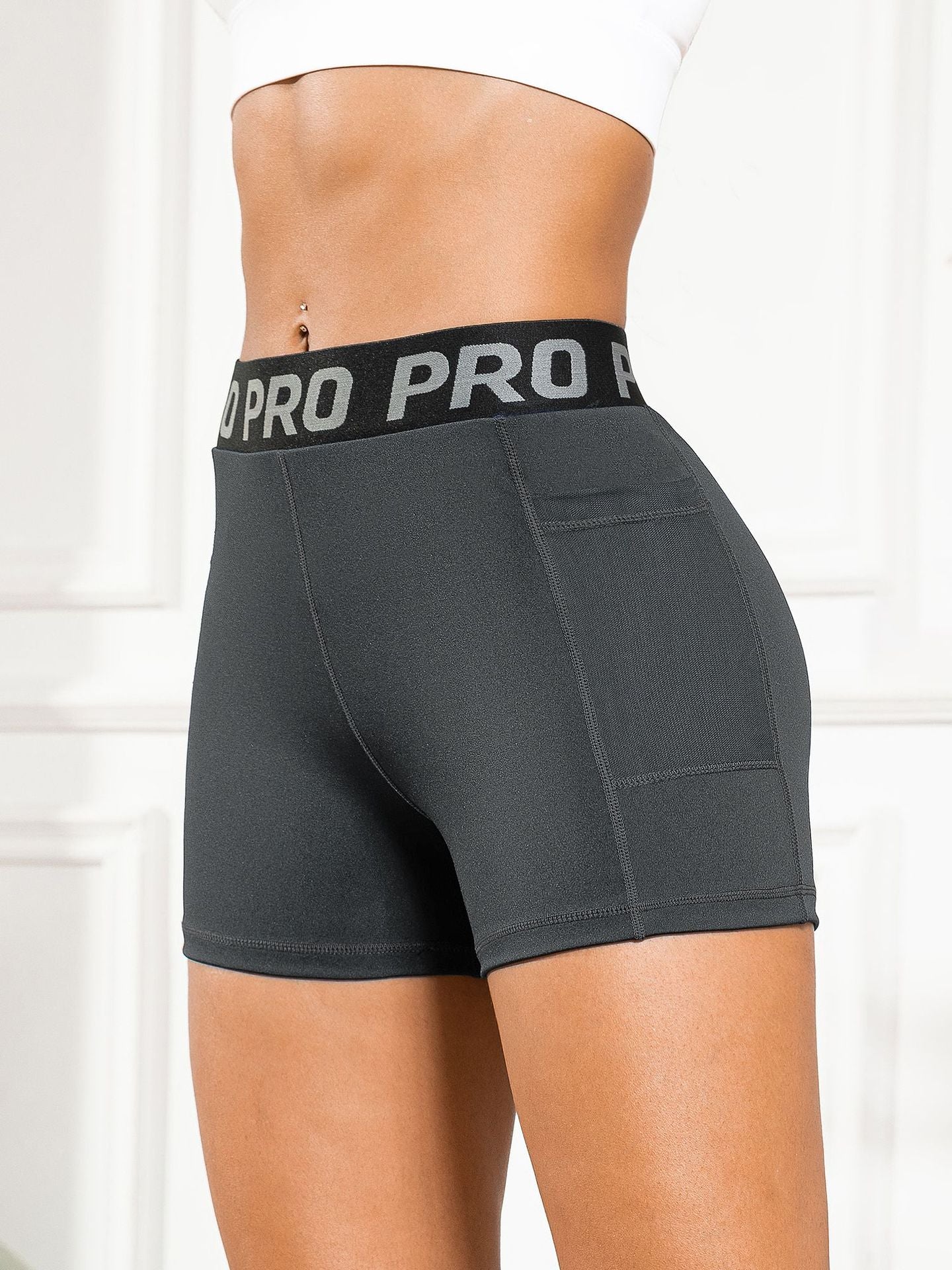 Women's High-Waisted Butt-Lifting Yoga Pants with Mesh Pockets and Three-Quarter Length for Running and Fitness